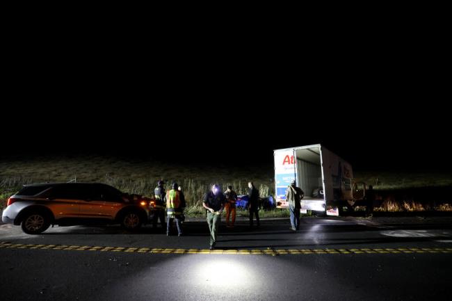 First respo<em></em>nders investigate a fatal crash involving multiple vehicles and a moving truck on Stage Gulch Road/Highway 116 just east of the intersection with Old Adobe Road in Petaluma, Tuesday, Aug. 1, 2023. (Beth Schlanker / The Press Democrat)