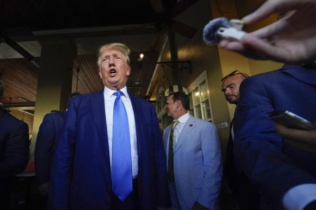 FILE - Former President Do<em></em>nald Trump visits Café du Mo<em></em>nde in New Orleans, July 25, 2023. (AP Photo/Gerald Herbert, File)