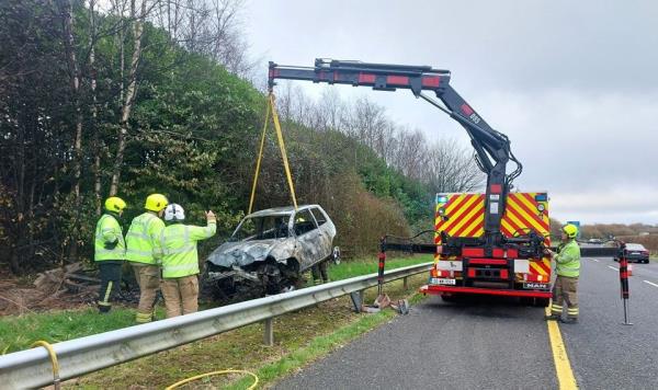 The burned out car is removed