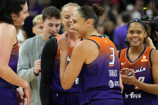 Phoenix Mercury player Diana Taurasi celebrates after making her 10,000th career point during the second half against the Atlanta Dream, Thursday, Aug. 3, 2023, in Phoenix. Taurasi, the WNBA's all-time leading scorer, is the o<em></em>nly player in league history to reach the 10,000 point milestone. (Matt York / ASSOCIATED PRESS)