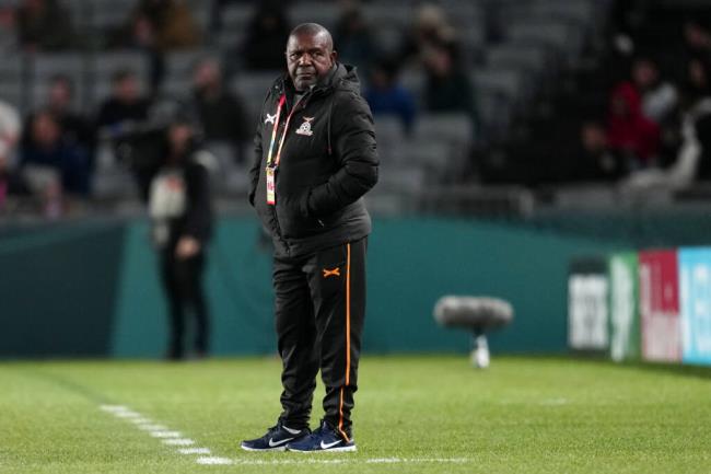 Zambia's head coach Bruce Mwape stands by the touchline during the Women's World Cup Group C soccer match between Spain and Zambia at Eden Park in Auckland, New Zealand, Wednesday, July 26, 2023. (AP Photo/Abbie Parr)