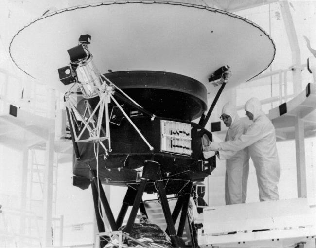 FILE - In this Aug. 4, 1977, photo provided by NASA, the "Sounds of Earth" record is mounted on the Voyager 2 spacecraft in the Safe-1 Building at the Kennedy Space Center, Fla. On Wednesday, Aug. 2, 2023, NASA's Deep Space Network sent a command to correct a problem with its antenna. It took more than 18 hours for the signal to reach Voyager 2 _ more than 12 billion miles away _ and another 18 hours to hear back. On Friday, Aug. 4, the spacecraft started returning data again. (AP Photo/NASA, File)